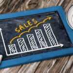 sales graph concept hand drawing on blackboard