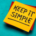 keep it simple inspirational writing - reminder note on a brown textured mulberry paper