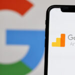 In this photo illustration,the logo of Google Analytics 4,is displayed on a smartphone